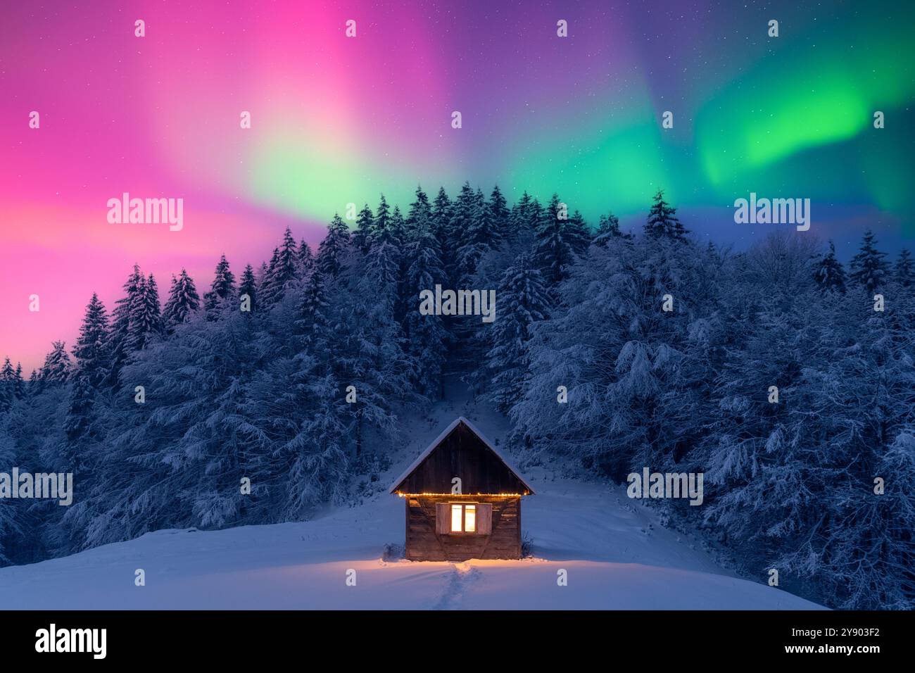 Cozy wooden cabin in snowy forest under incredible Northern lights in ...