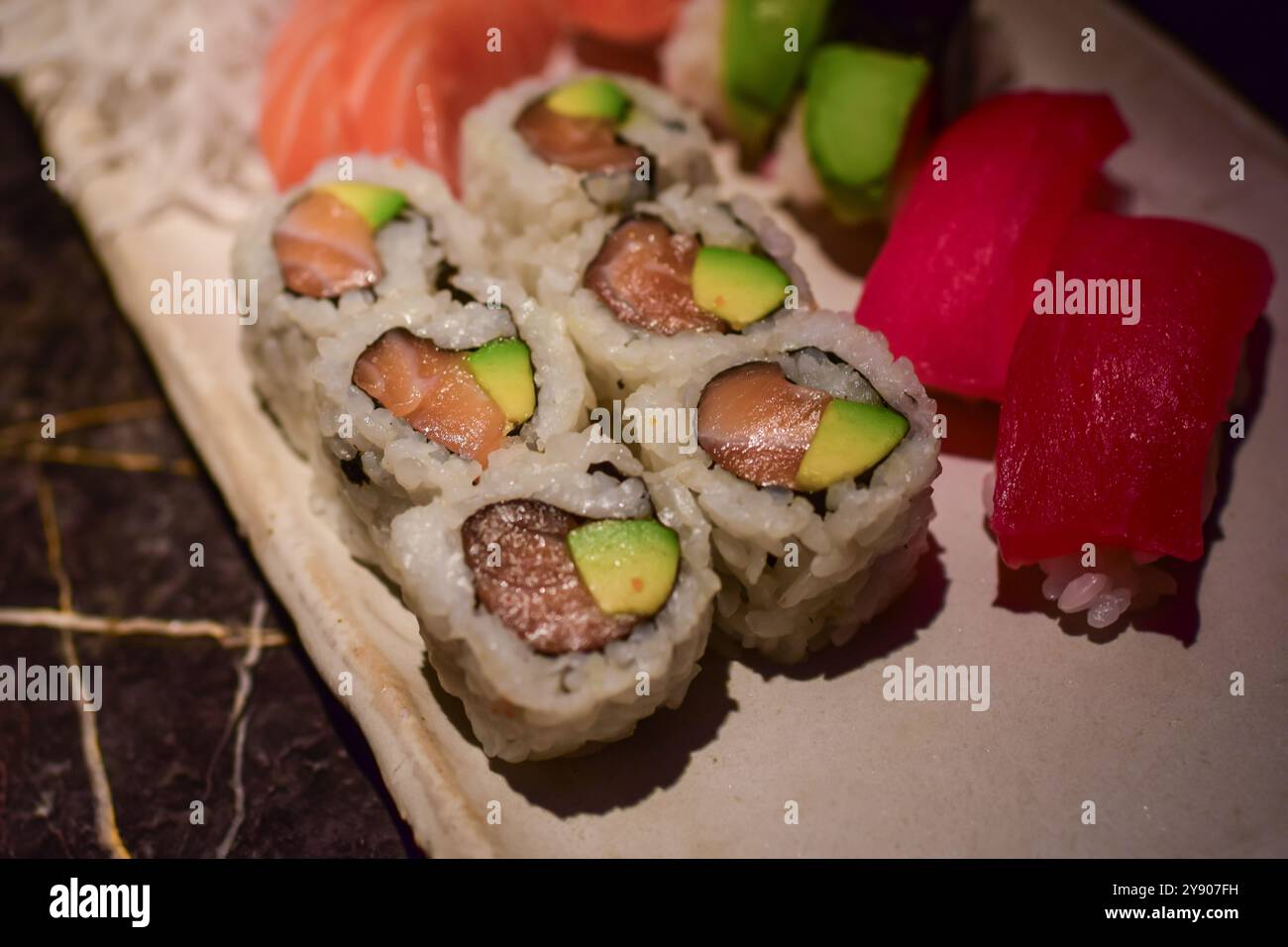 Assorted nigiri and sushi rolls in Sushi restaurant Stock Photo