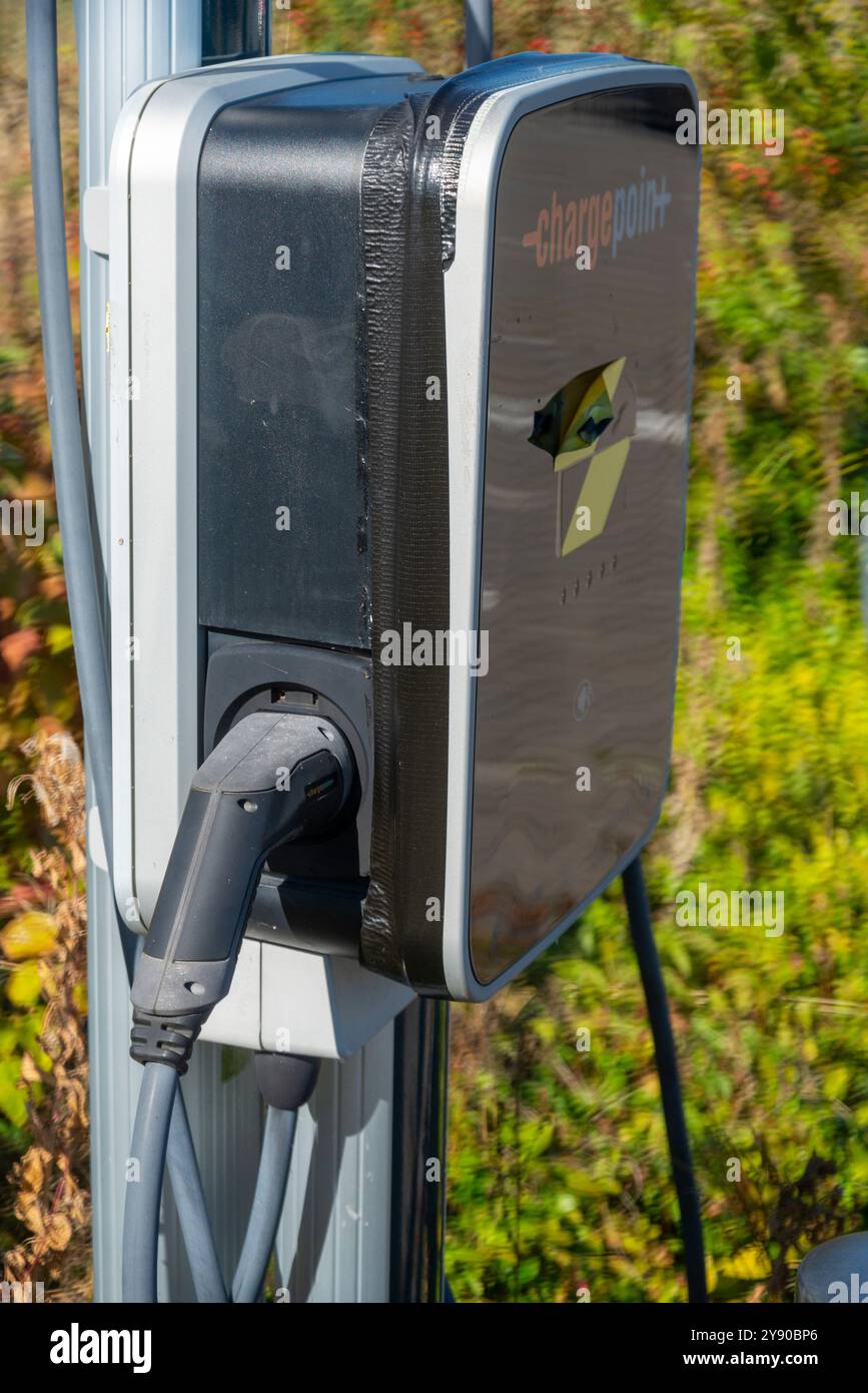 Worcester,England,UK-September 17 2024:An EV charge point,standing outside,ready to use, at a public electric vehicle charging location,within a railw Stock Photo