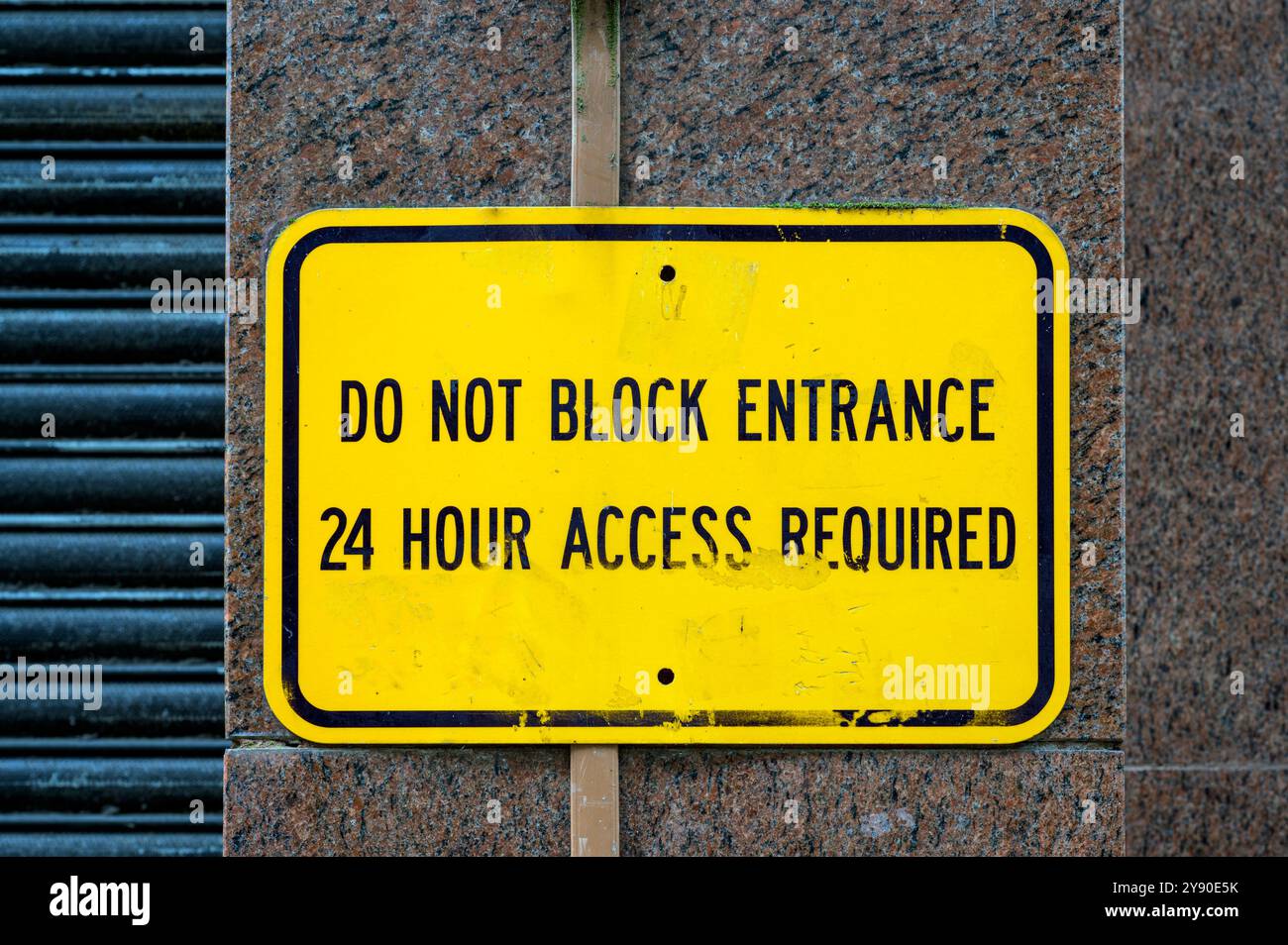 Worn 24 Hour Access Required sign, UK Stock Photo - Alamy