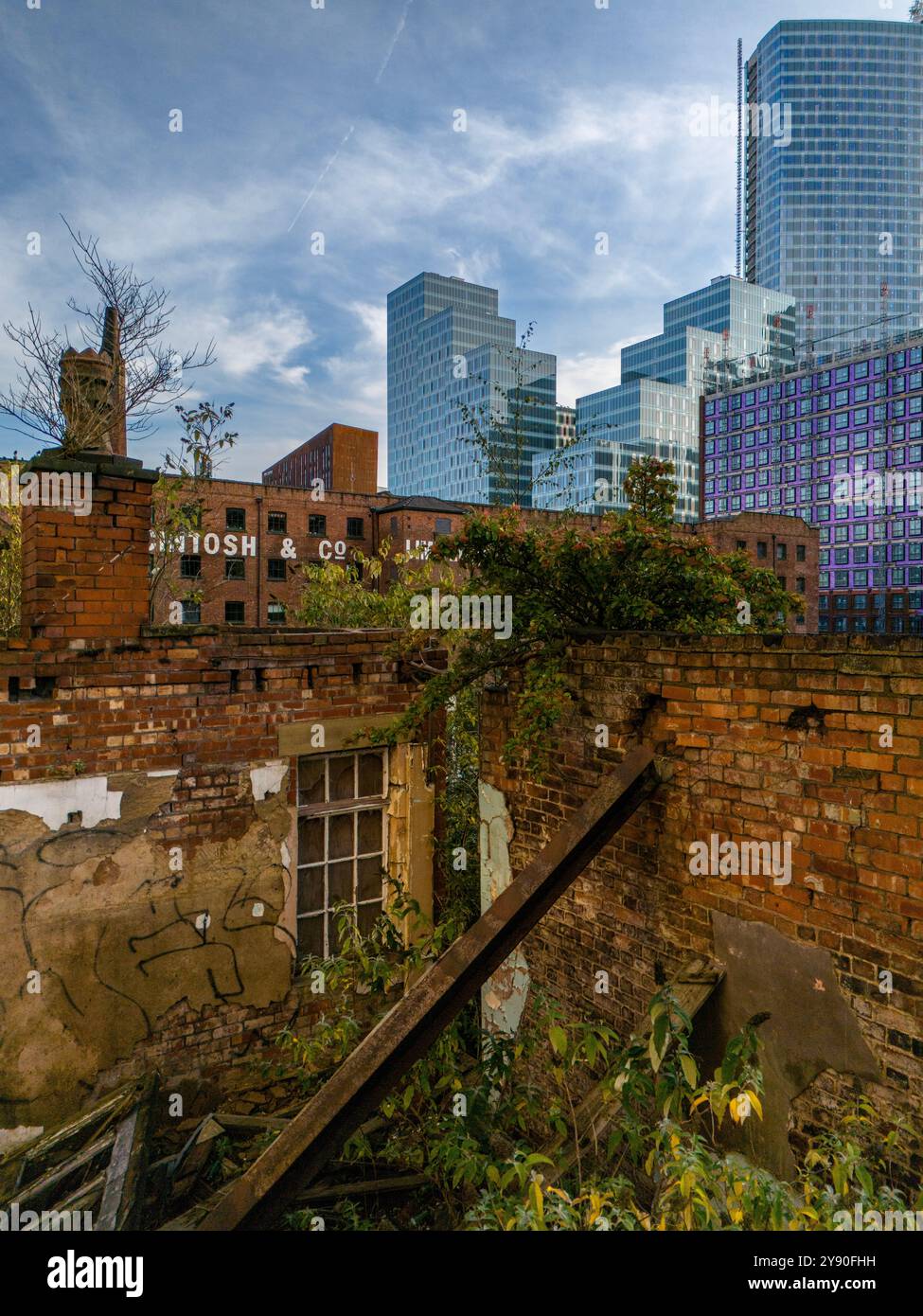 Derelict Building and Modern Apartments Stock Photo - Alamy