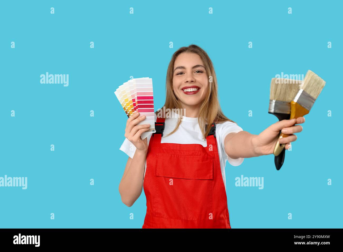 Female painter with color palettes and brushes on blue background Stock ...