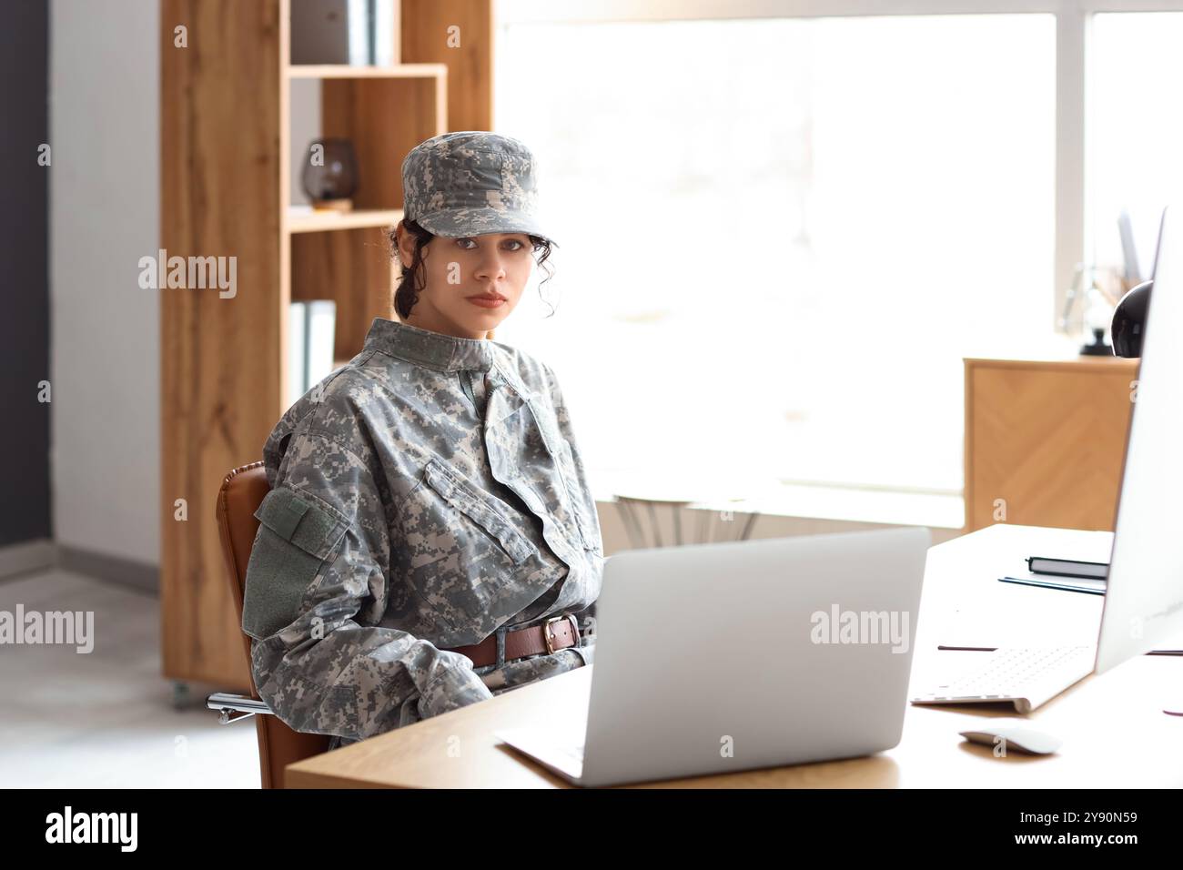 Female African-American soldier sitting at headquarters Stock Photo - Alamy