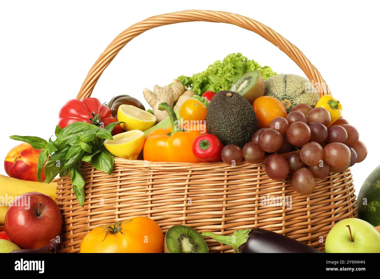 Many different fruits and vegetables in wicker basket isolated on white ...