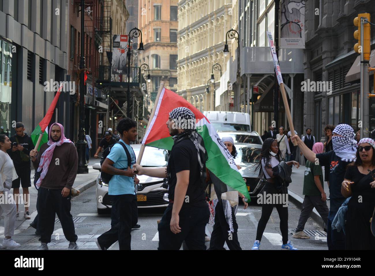 Protesters marching during a Pro Palestine march on the anniversary of the October 7 attacks in Israel in New York City. Stock Photo