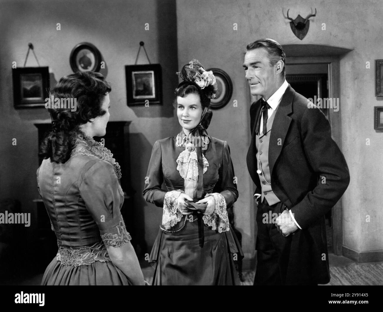 Phyllis Thaxter, Helena Carter, Randolph Scott, on-set of the western ...