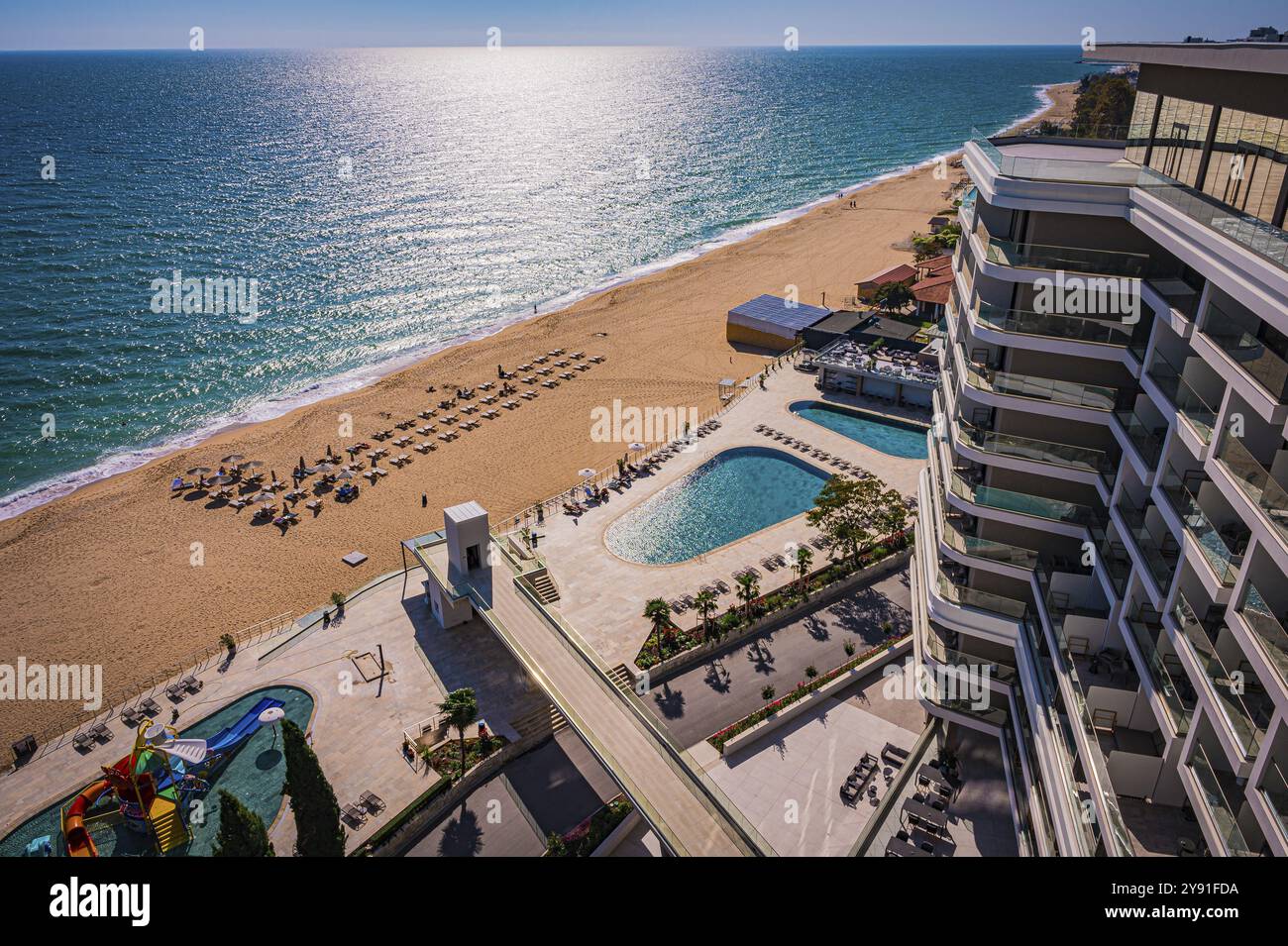 View of a hotel complex with pool on the beach, the Black Sea stretches into the distance, Golden Sands, Varna, Bulgaria, Europe Stock Photo