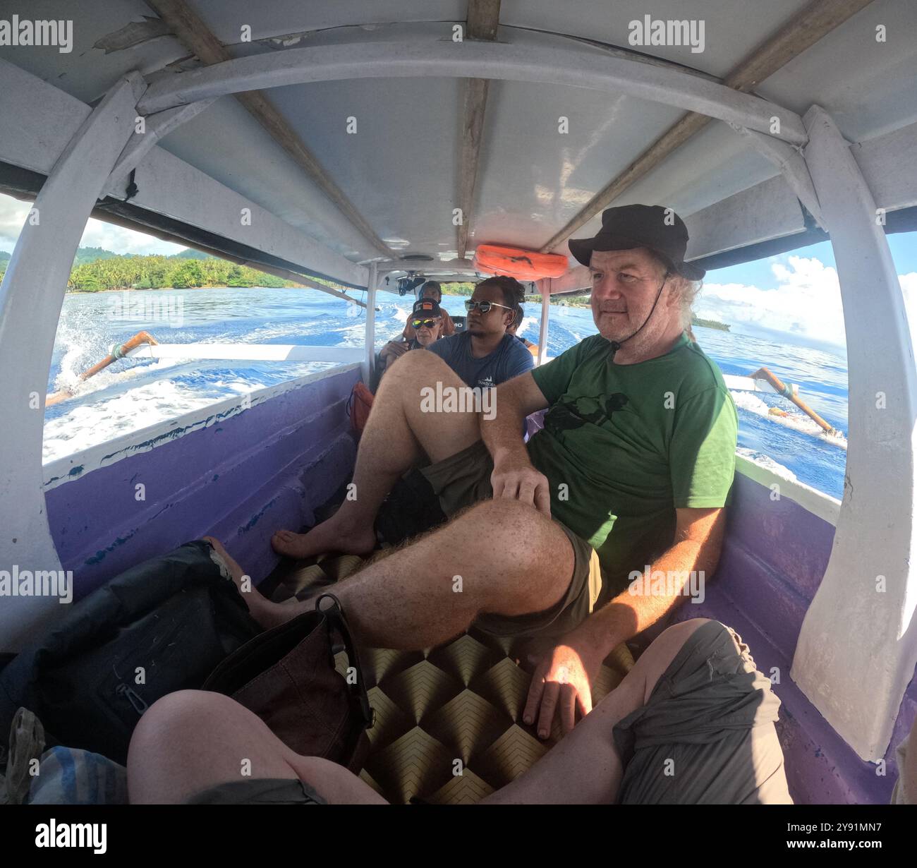 Tourists and locals on interisland water transport boat, Togean Islands, Sulawesi, Indonesia. NO MR Stock Photo