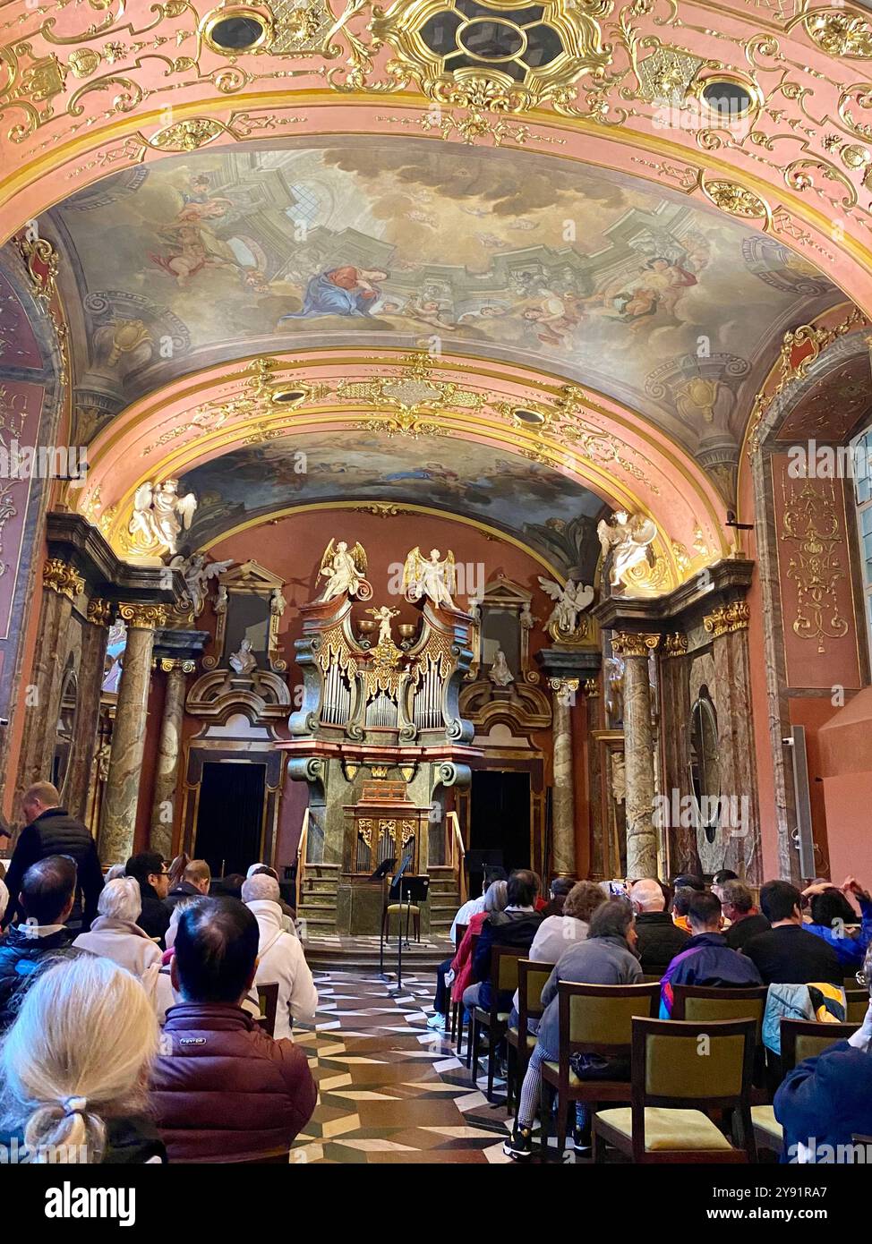 Klementinum Mirror Chapel in Prague city centre, built in 1725, audience awaits classical music performance by Royal Czech Orchestra,Czech Republic - Smartphone Captured Stock Image