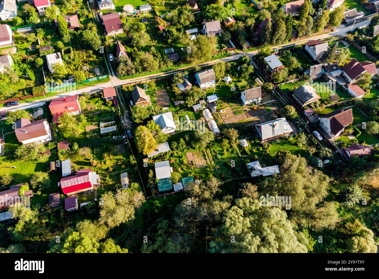 Drone flight over roofs of country houses in the countryside Stock ...