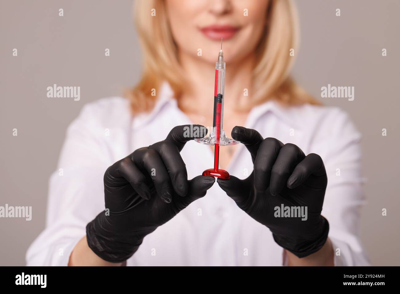 woman cosmetologist holds cosmetology syringes close-up, professional skin care for her health, youth and beauty, modern cosmetology and aesthetic med Stock Photo