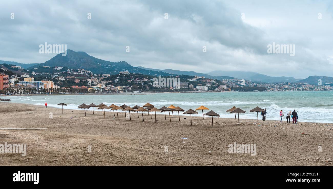 Malaga, Spain - April 29, 2017: A serene off-season beachfront with strolling visitors. Stock Photo