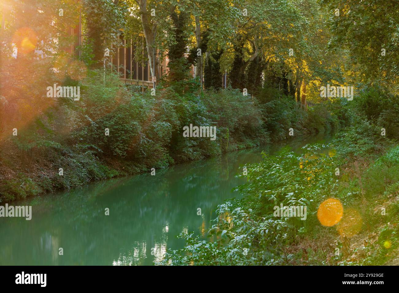 Sunset at the Canal de Brienne, which is a French canal connecting the Garonne River with the Canal du Midi and the Canal de Garonne in the city of To Stock Photo