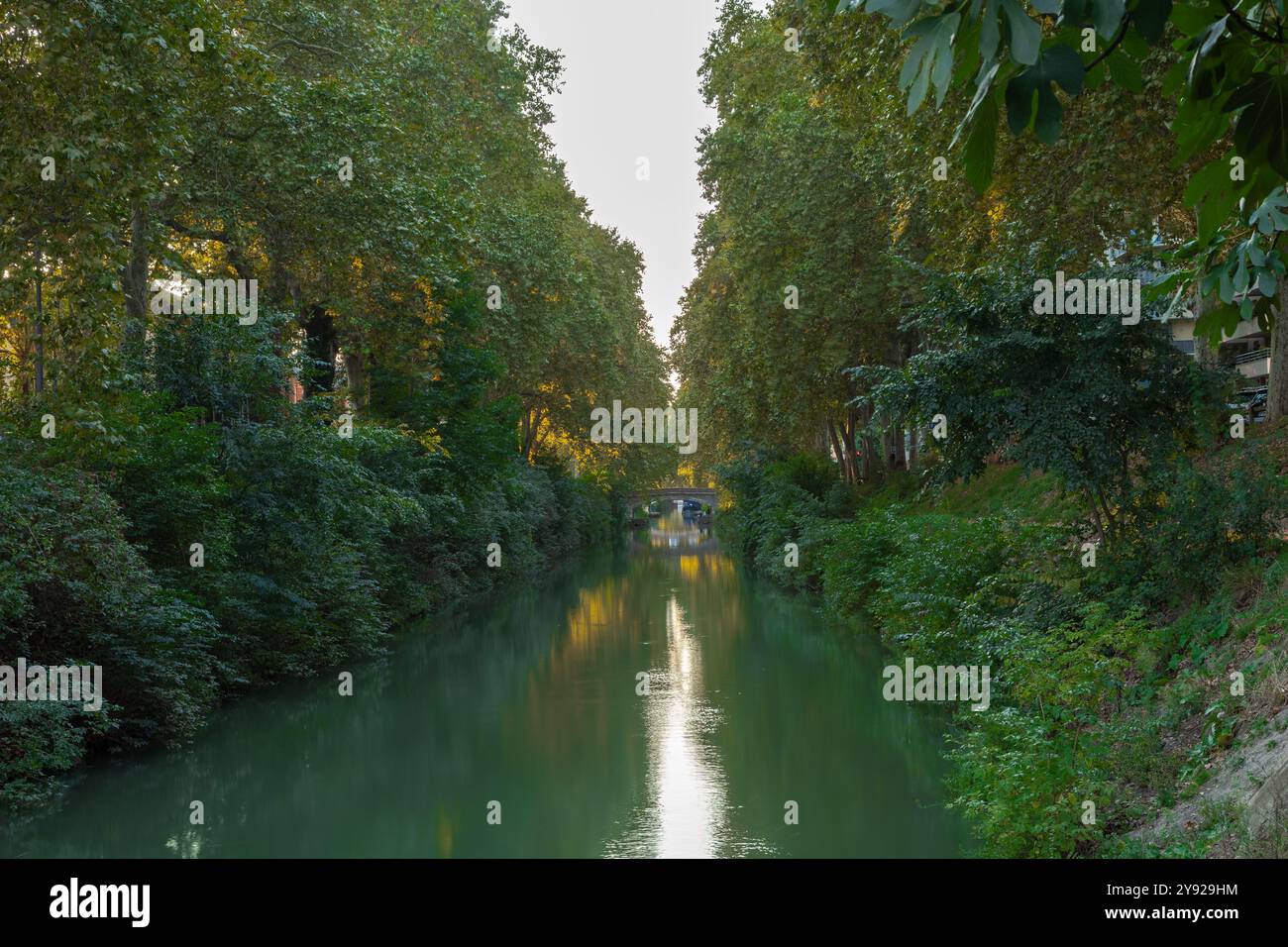 Sunset at the Canal de Brienne, which is a French canal connecting the Garonne River with the Canal du Midi and the Canal de Garonne in the city of To Stock Photo