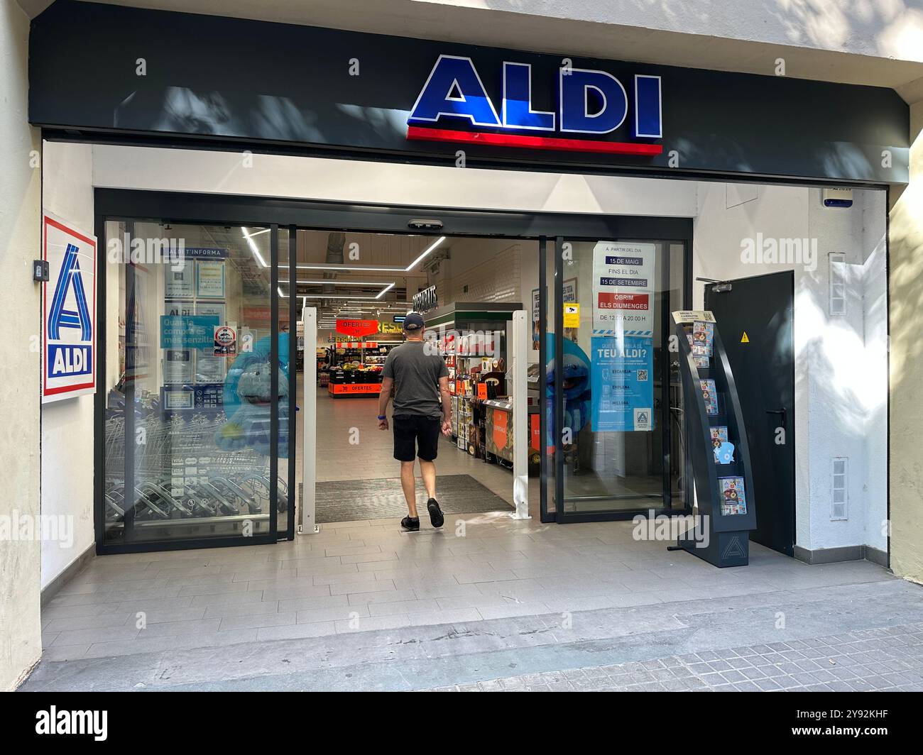 Barcelona, Spain 22 June 2024; Shopper entering a branch of the Aldi supermarket chain in the city of Barcelona - Smartphone Captured Stock Image