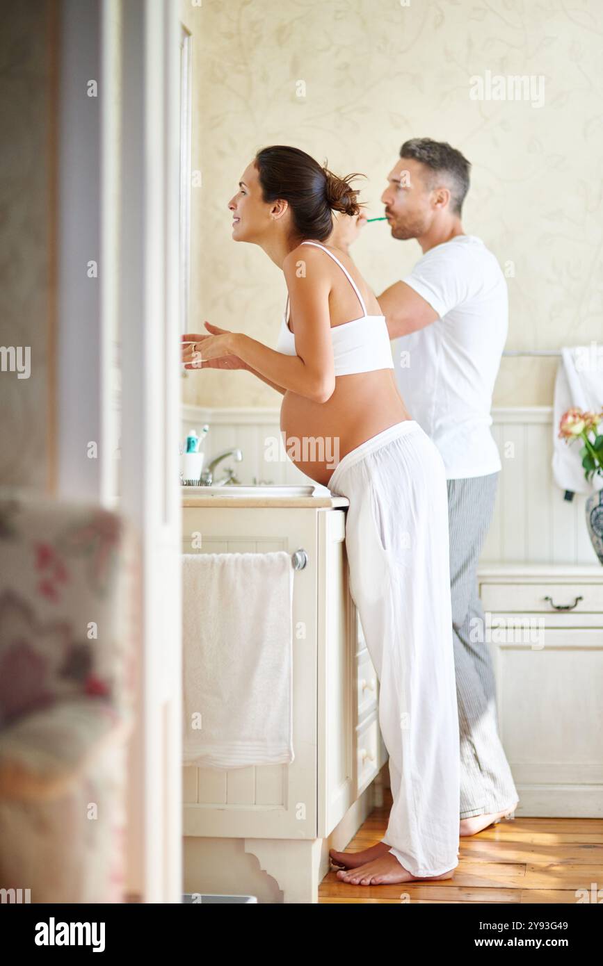 Morning, pregnancy and couple in bathroom for brushing teeth, washing ...
