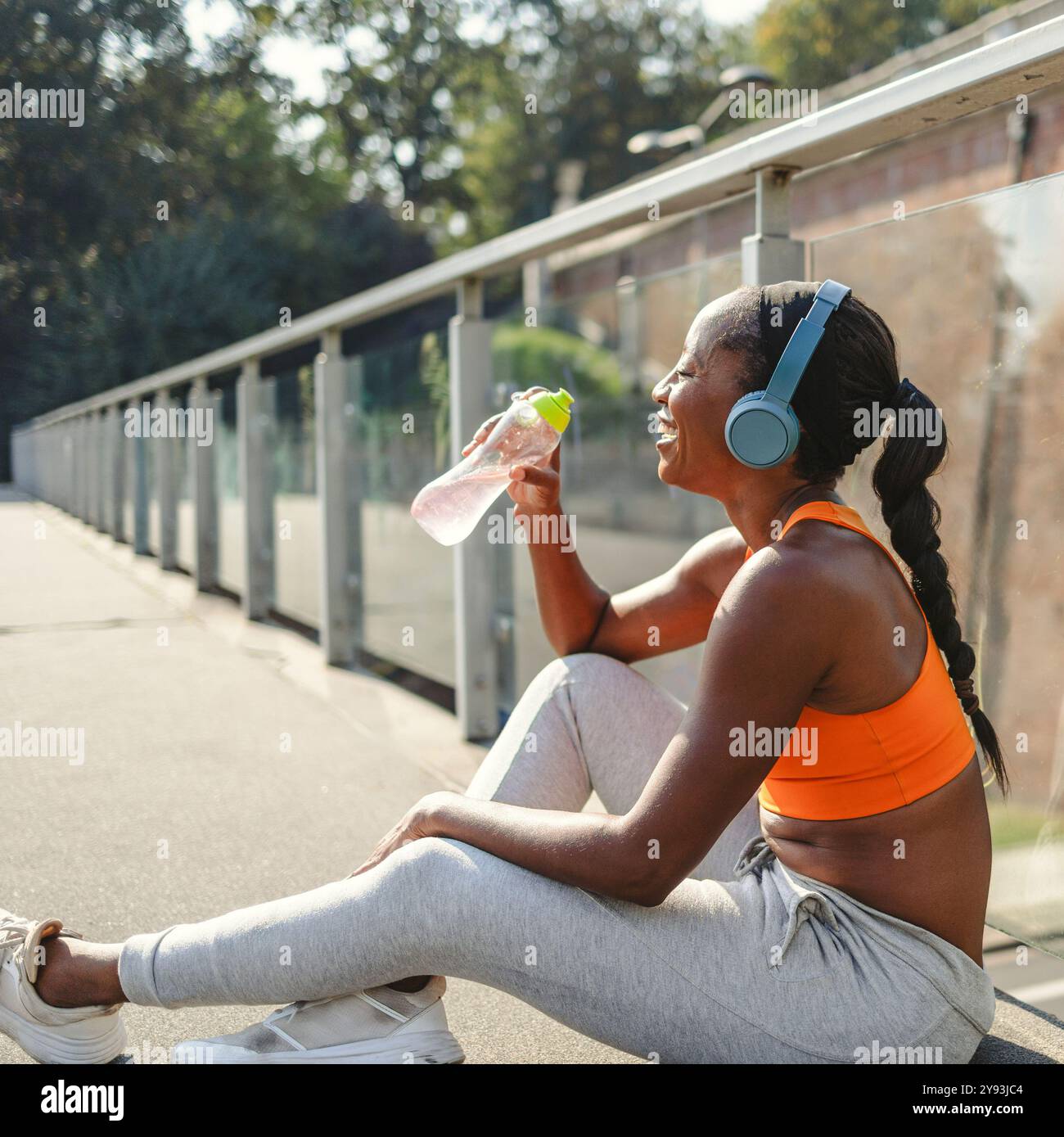 Black sportswoman drinking water after hi-res stock photography and ...