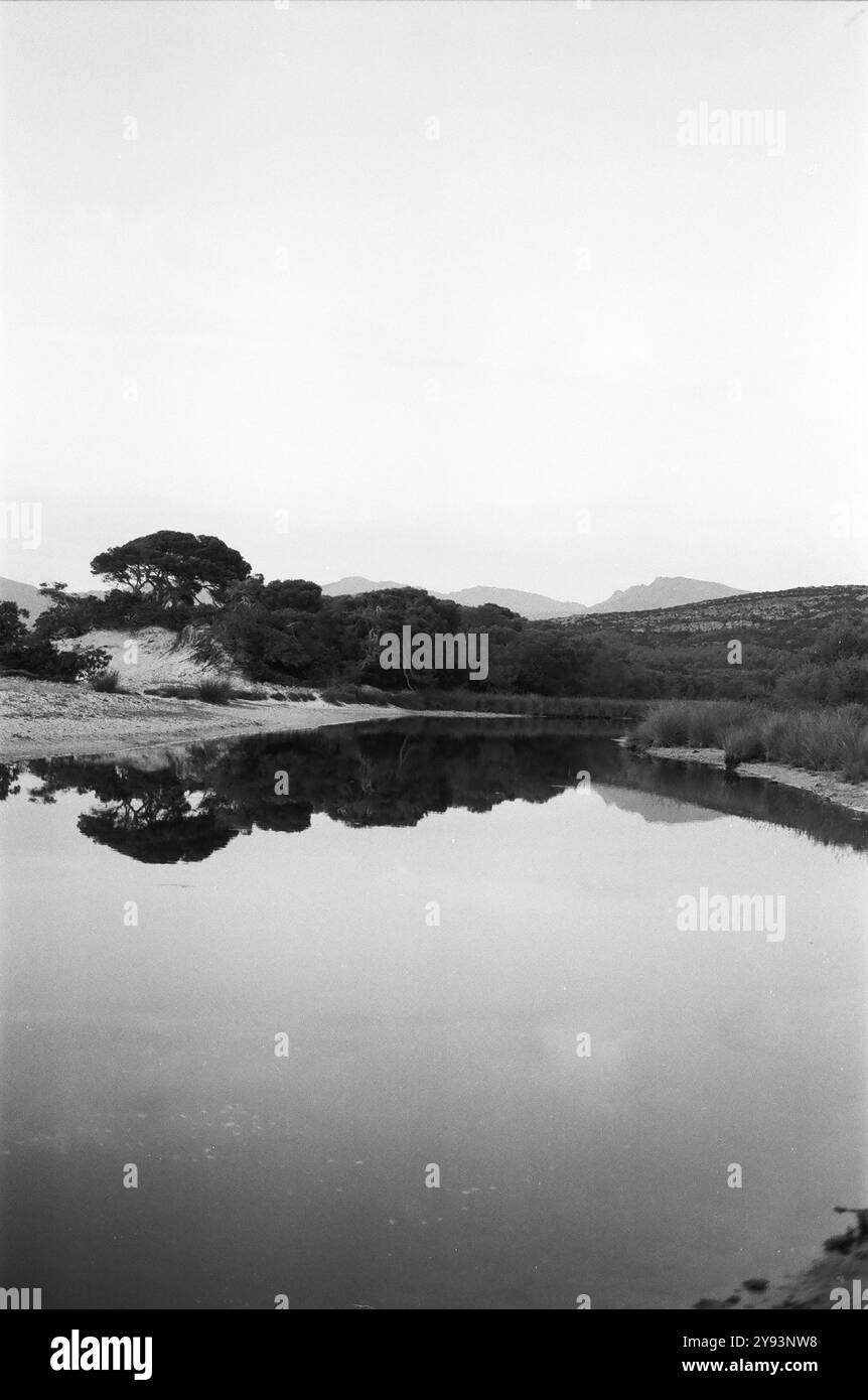 Calm water lake surrounded Black and White Stock Photos & Images - Alamy