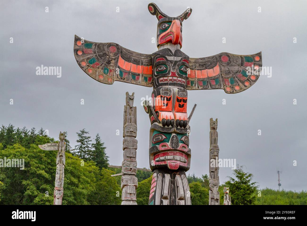Totem poles in the cemetery of the First Nations Kwakwaka'wakw people in Alert Bay, British Columbia, Canada, North America Stock Photo