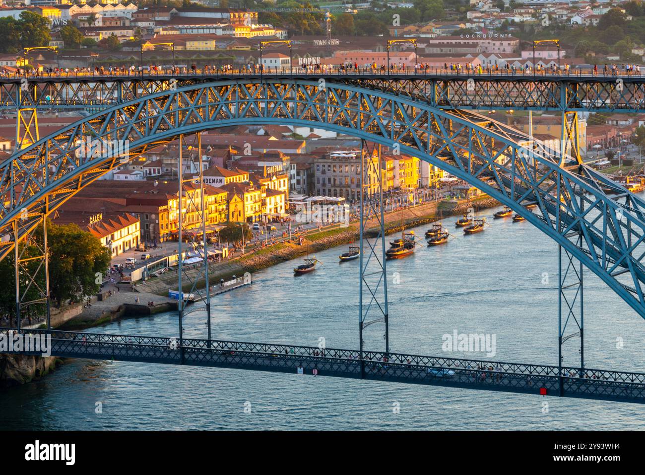 Rabelo Boats on the River Douro with the Dom Luis l Bridge at dusk, UNESCO World Heritage Site, Porto, Norte, Portugal, Europe Stock Photo