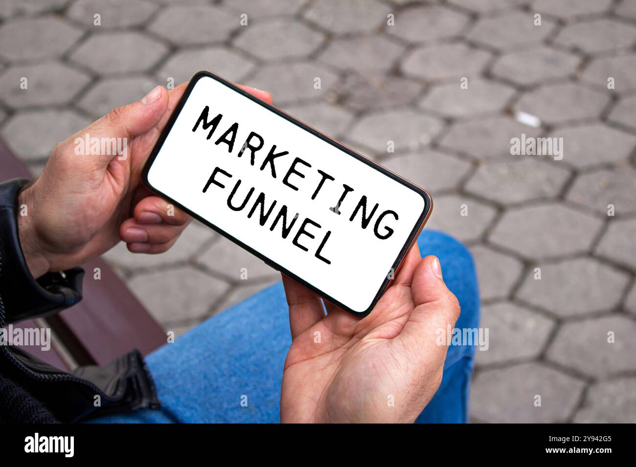 Marketing funnel message written on smartphone screen. Conceptual marketing funnel symbol. Copy space. Stock Photo