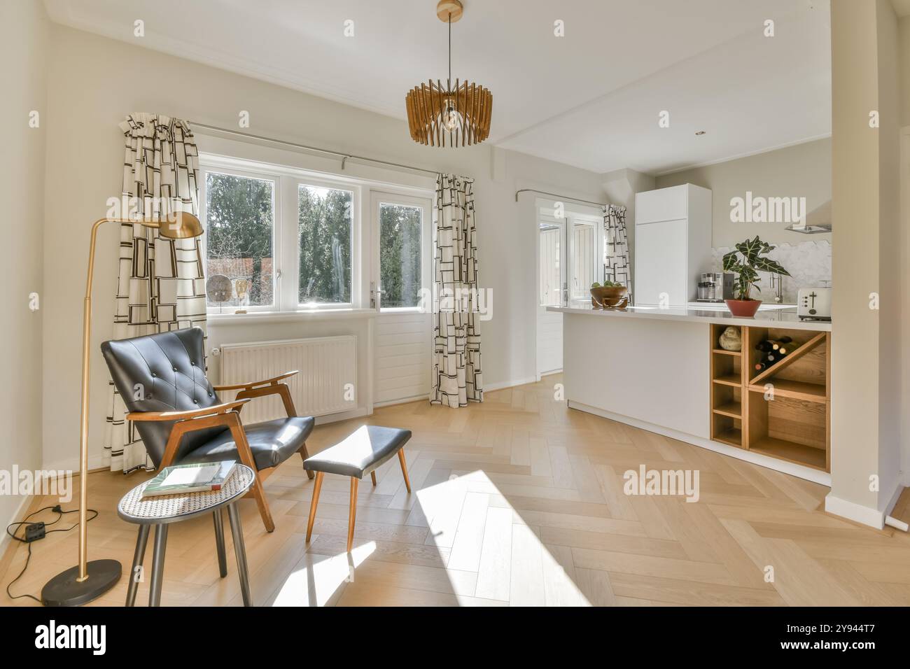 A spacious living room with a modern featuring bright — free download
