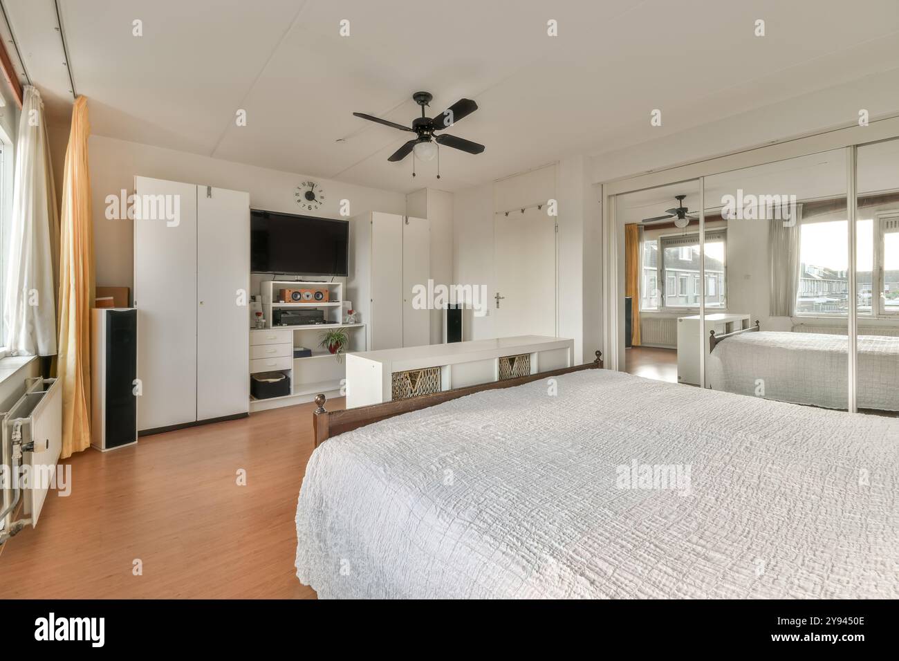 Gallery Detail: A Well Lit Studio Apartment Space Featuring A Comfortable Bed