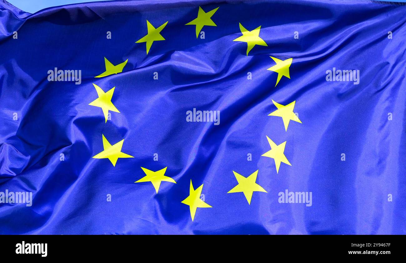The flag of the EU European Union flutters in the wind Stock Photo - Alamy