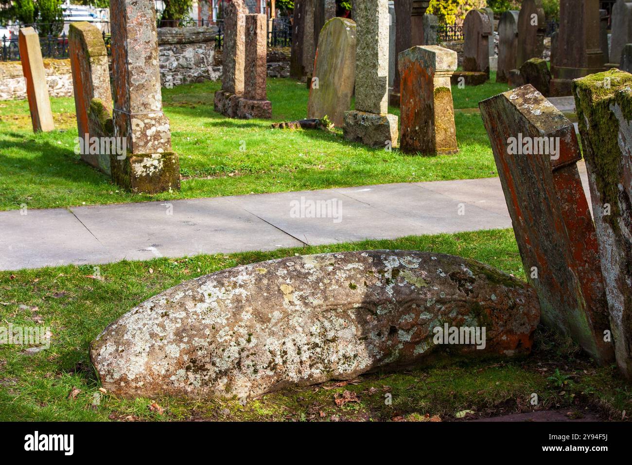 Rare 11th century hog-backed Viking gravestone in the churchyard of St Kessog's Church in the village of Luss on the shores of Loch Lomond, Scotland Stock Photo