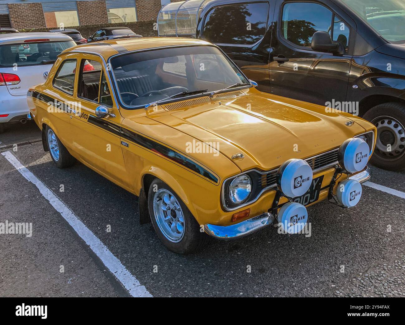 A 1971, Yellow Mk1, Ford Escort Mexico, parked in Sainsburys Car Park, Deal, Kent - Smartphone Captured Stock Image