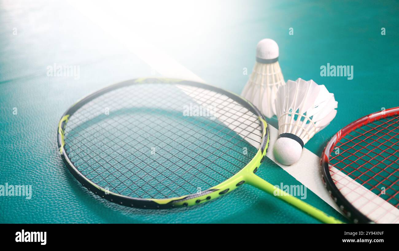 Badminton Competitive Racket White badminton shuttlecocks and badminton rackets on green floor ...