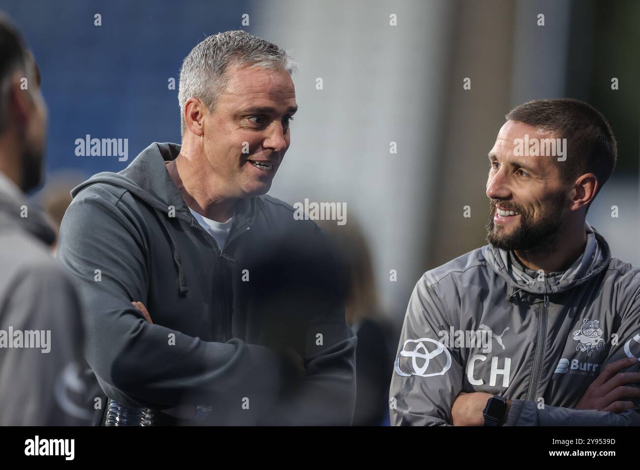 Huddersfield, UK. 08th Oct, 2024. Michael Duff of Huddersfield Town speaks to Conor Hourihane of Barnsley during the Bristol Street Motors Trophy match Huddersfield Town vs Barnsley at John Smith's Stadium, Huddersfield, United Kingdom, 8th October 2024 (Photo by Alfie Cosgrove/News Images) in Huddersfield, United Kingdom on 10/8/2024. (Photo by Alfie Cosgrove/News Images/Sipa USA) Credit: Sipa USA/Alamy Live News Stock Photo