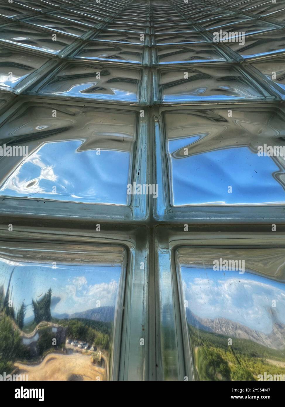 Abstract patterns through thick glass in cable car station on top of Mount Srd, Dubrovnik, Croatia - Smartphone Captured Stock Image