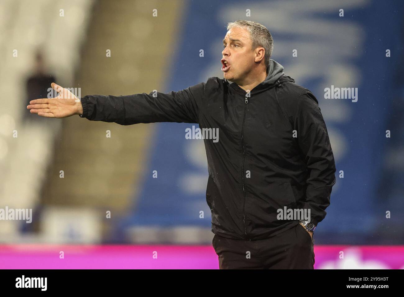 Michael Duff manager of Huddersfield Town gives his team instructions during the Bristol Street Motors Trophy match Huddersfield Town vs Barnsley at John Smith's Stadium, Huddersfield, United Kingdom, 8th October 2024  (Photo by Alfie Cosgrove/News Images) Stock Photo