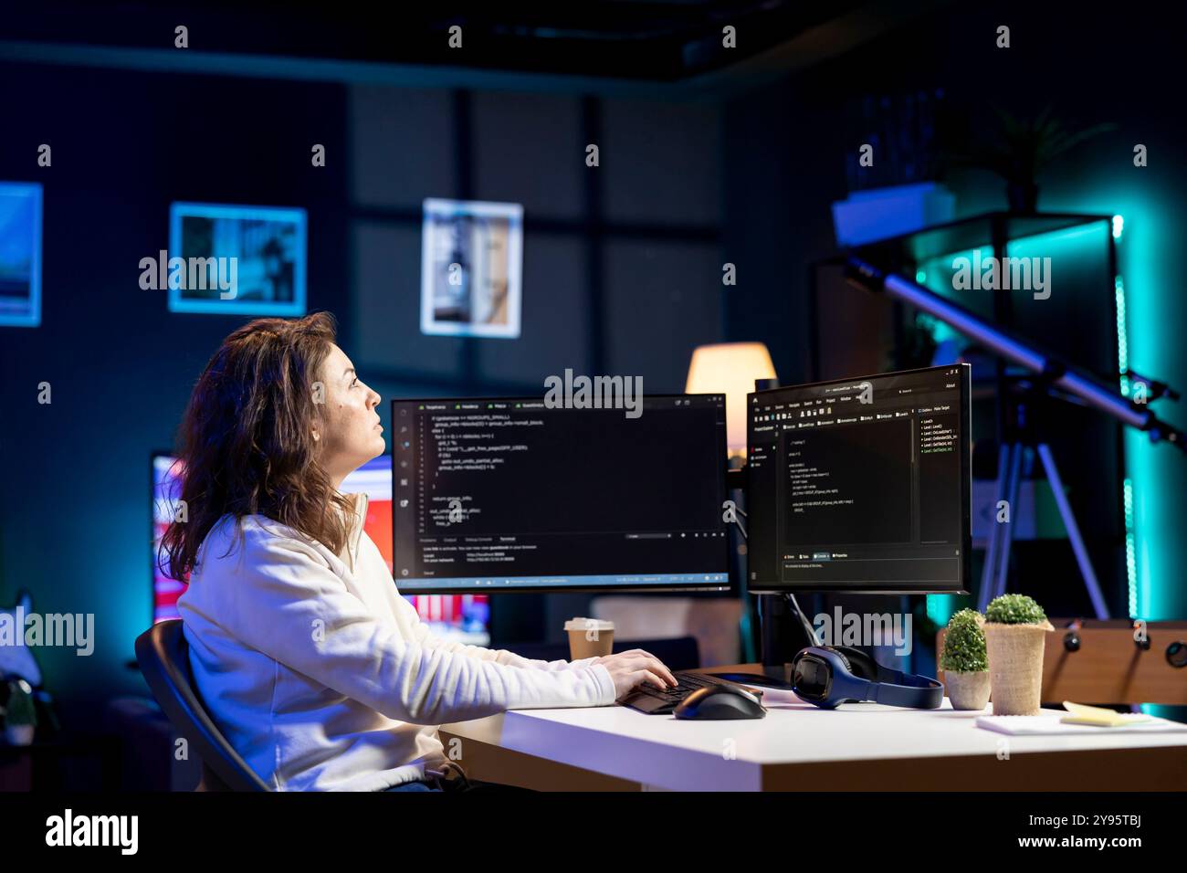Freelancing computer scientist securing company servers from virus attacks using augmented reality tech. IT remote worker looking at AR visualization, writing code to build firewalls protecting data Stock Photo