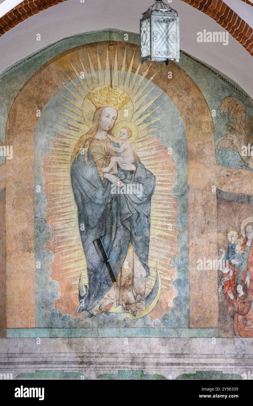 The Virgin Mary with Infant Jesus in Glory. A mural fresco in the Franciscan Friary near the Basilica of St Francis of Assisi in Kraków, Poland. Stock Photo