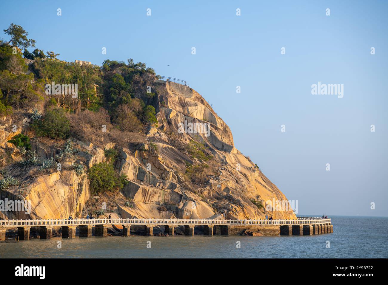 Beach in Gulangyu Island at sunset, Xiamen province, China, palm trees with copy space for text Stock Photo