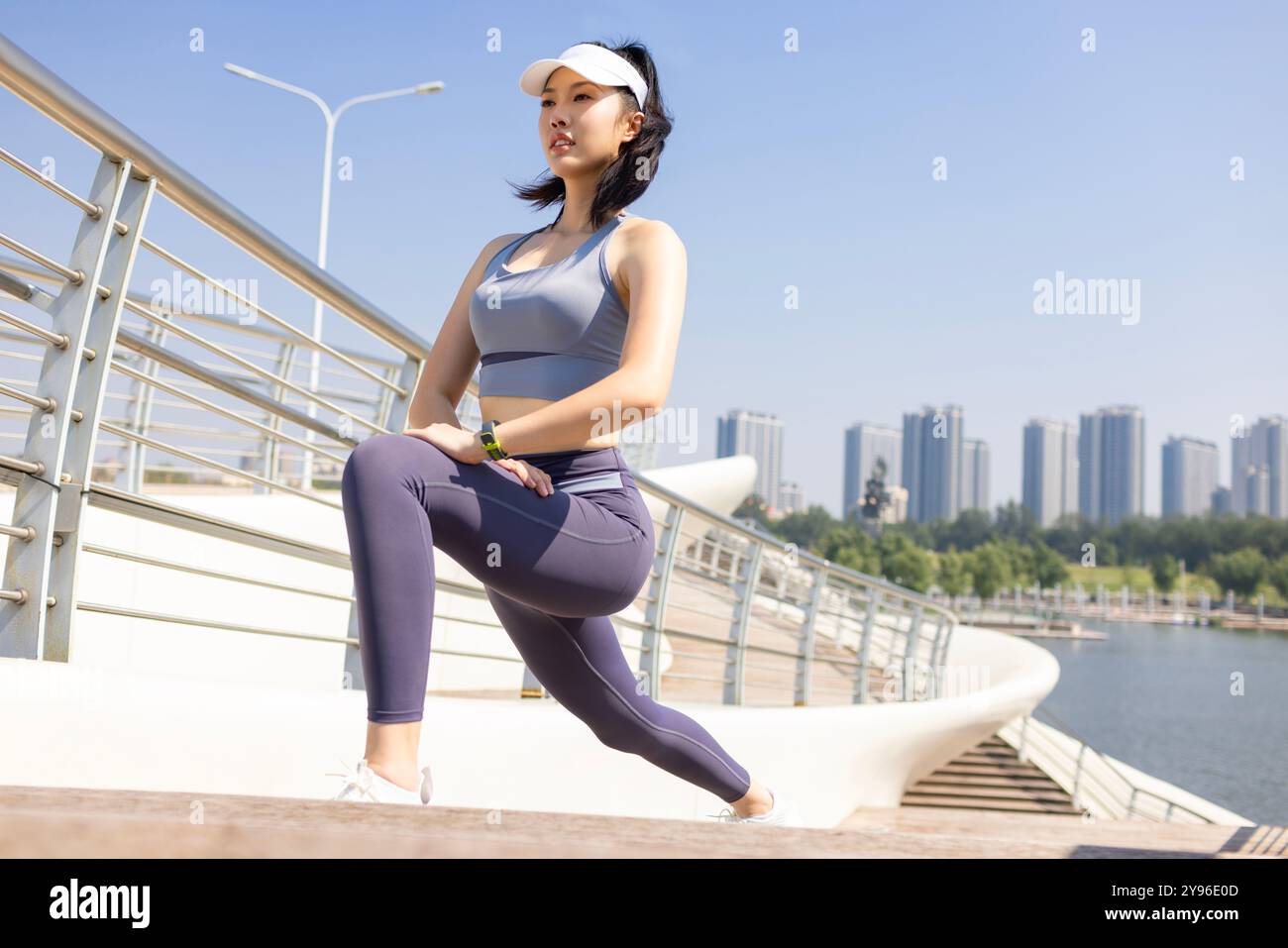 Young woman exercising in a park Stock Photo - Alamy