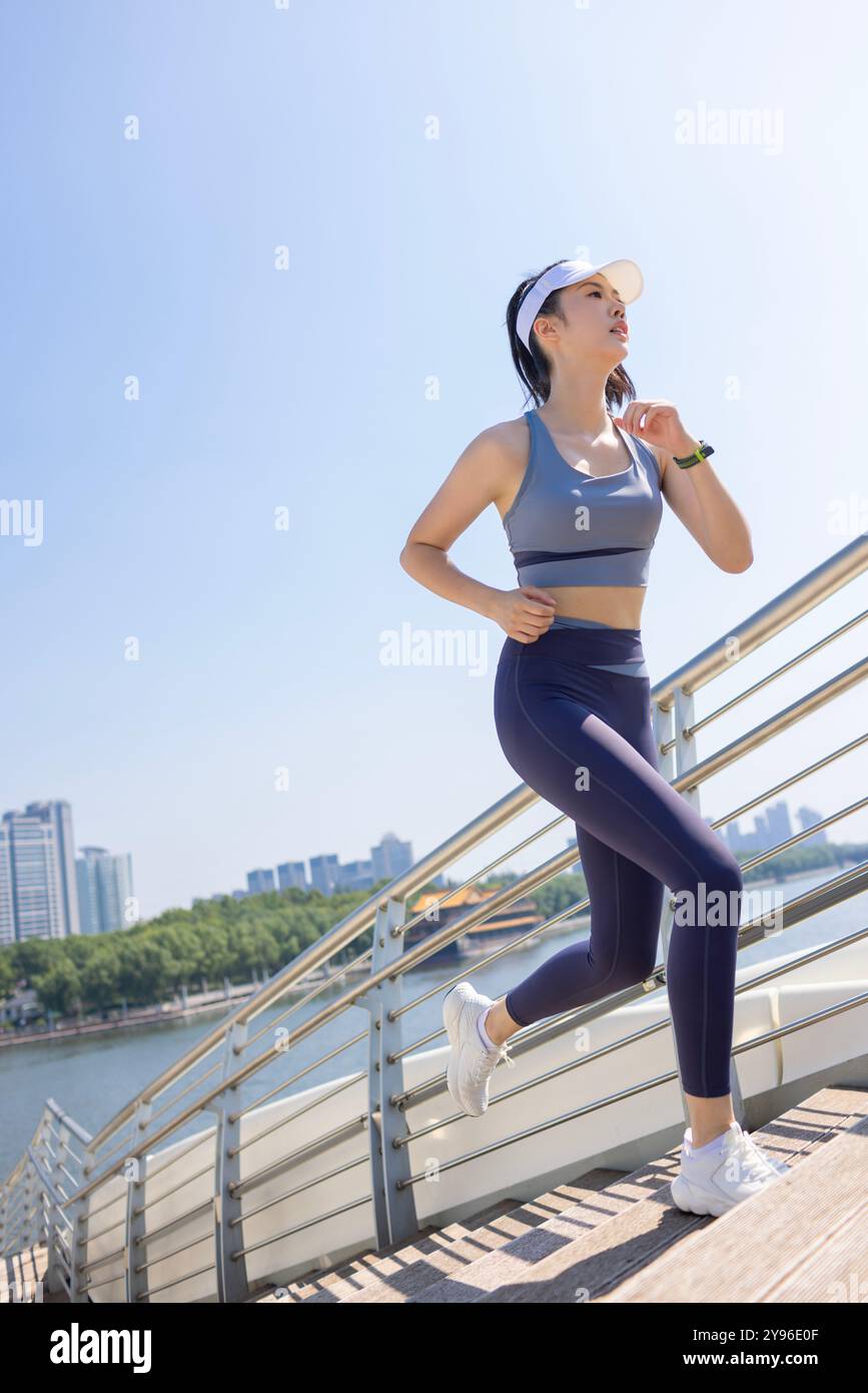 Young woman exercising in a park Stock Photo - Alamy