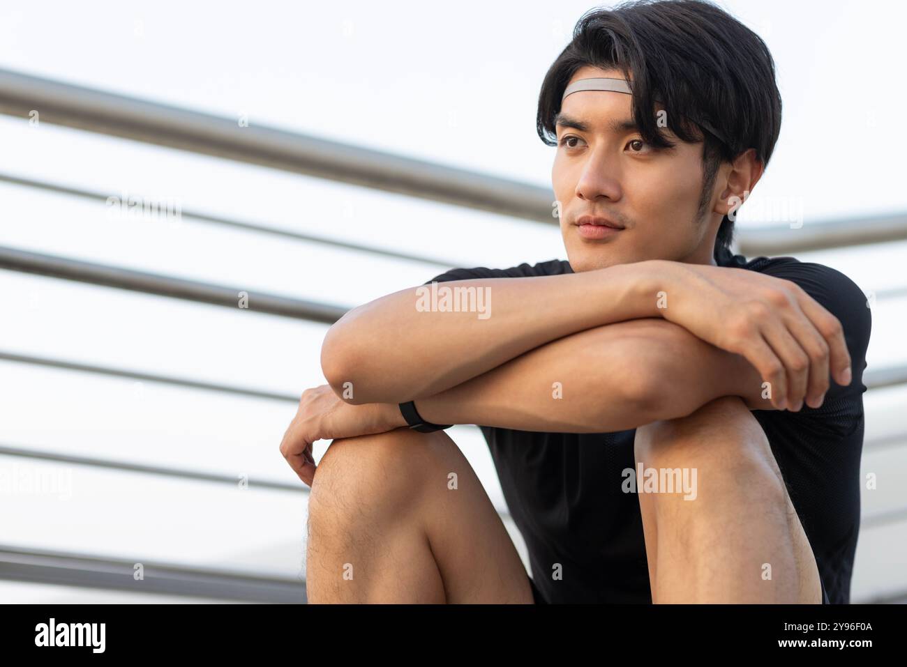 Young man sitting on the steps Stock Photo