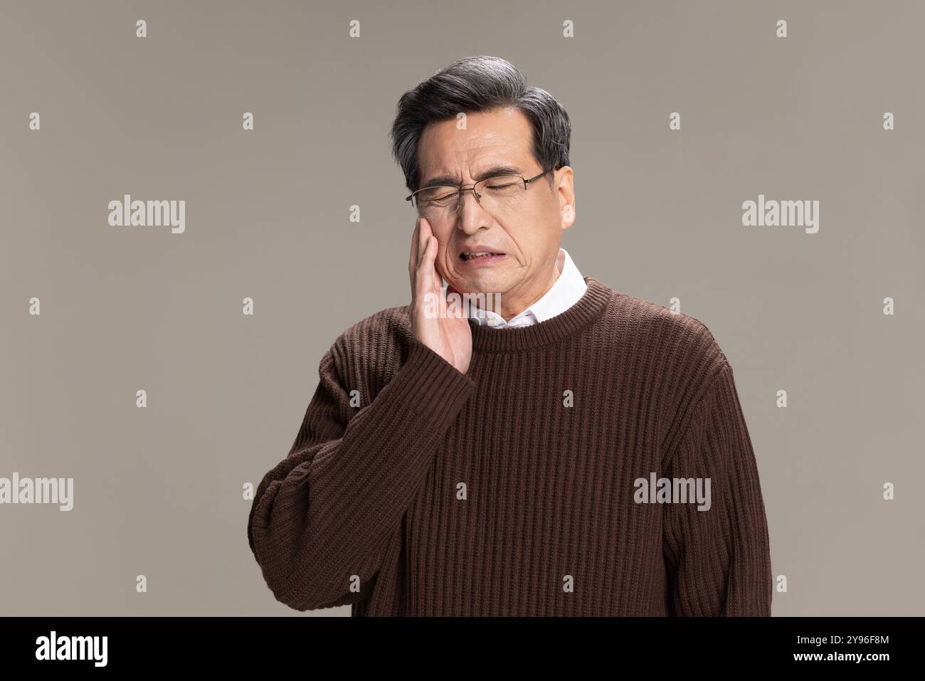 Senior man suffering from toothache Stock Photo