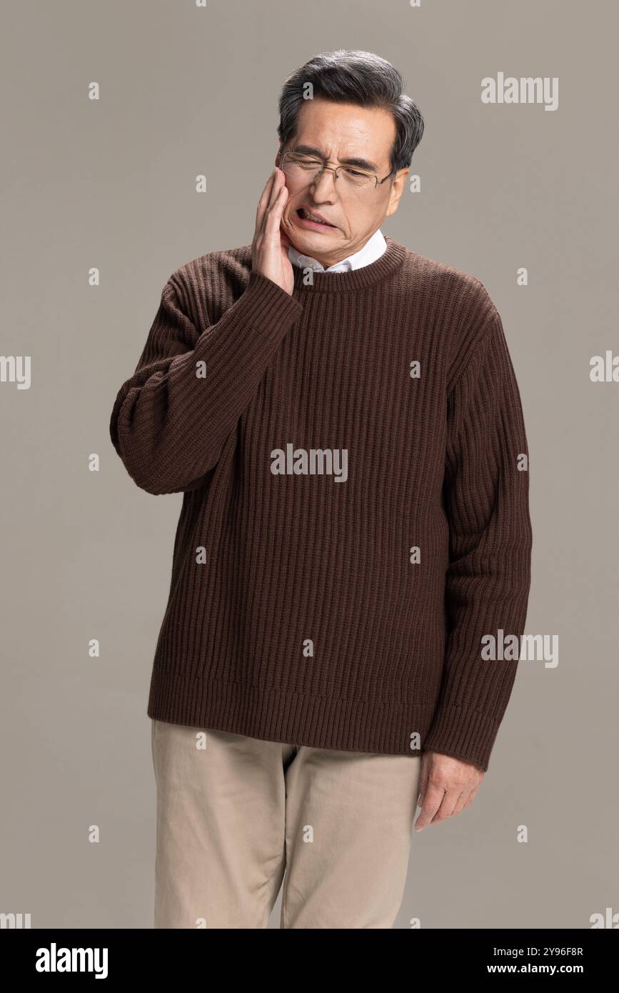 Senior man suffering from toothache Stock Photo