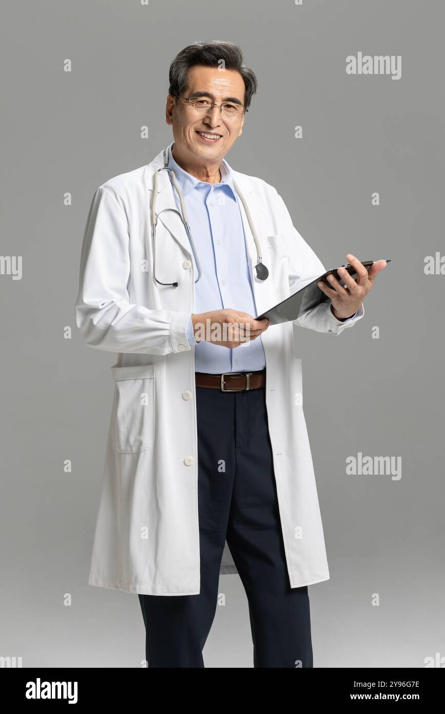 Smiling man asking doctor hi-res stock photography and images - Alamy
