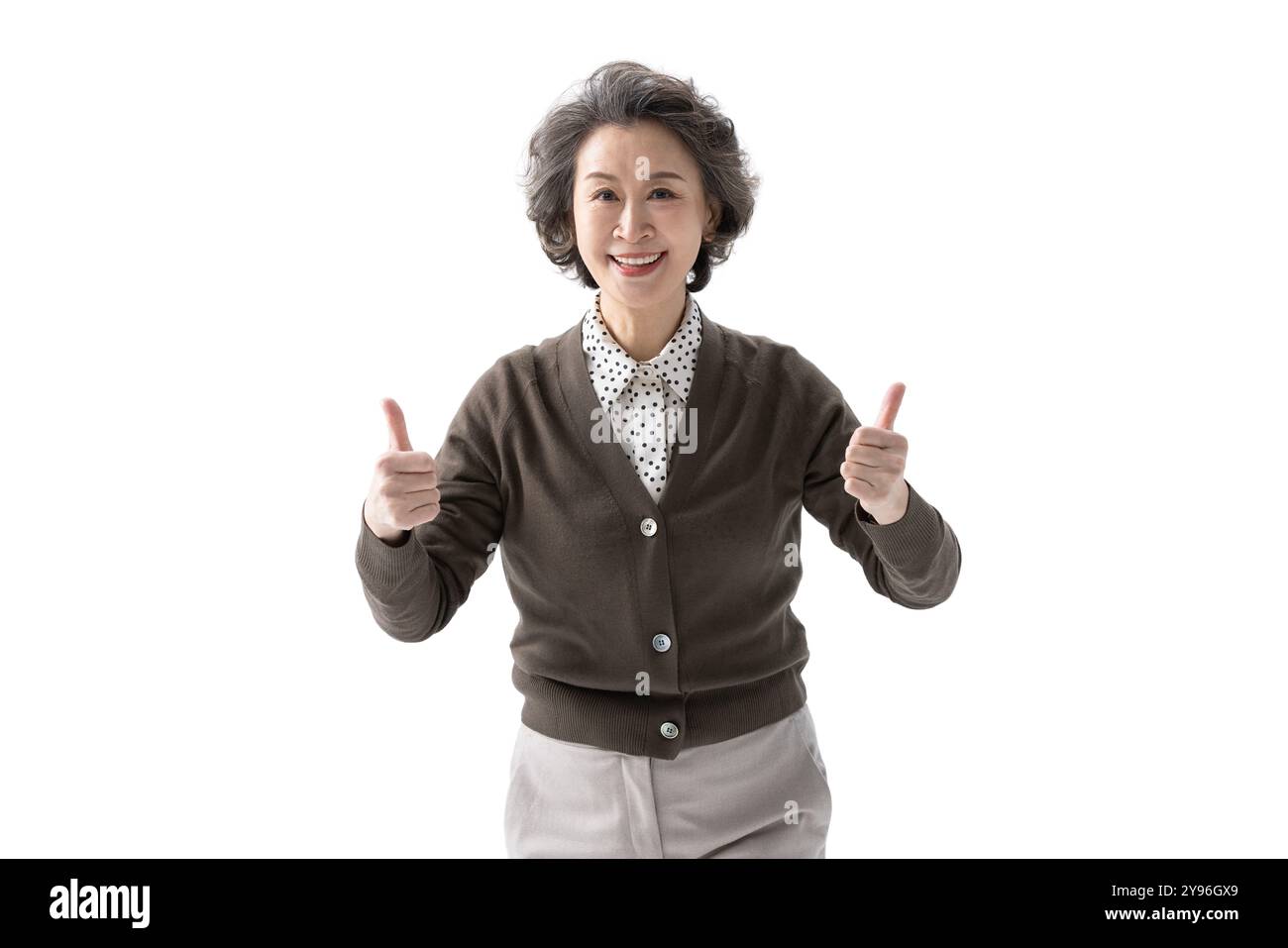 Happy senior woman doing thumbs up gesture Stock Photo - Alamy