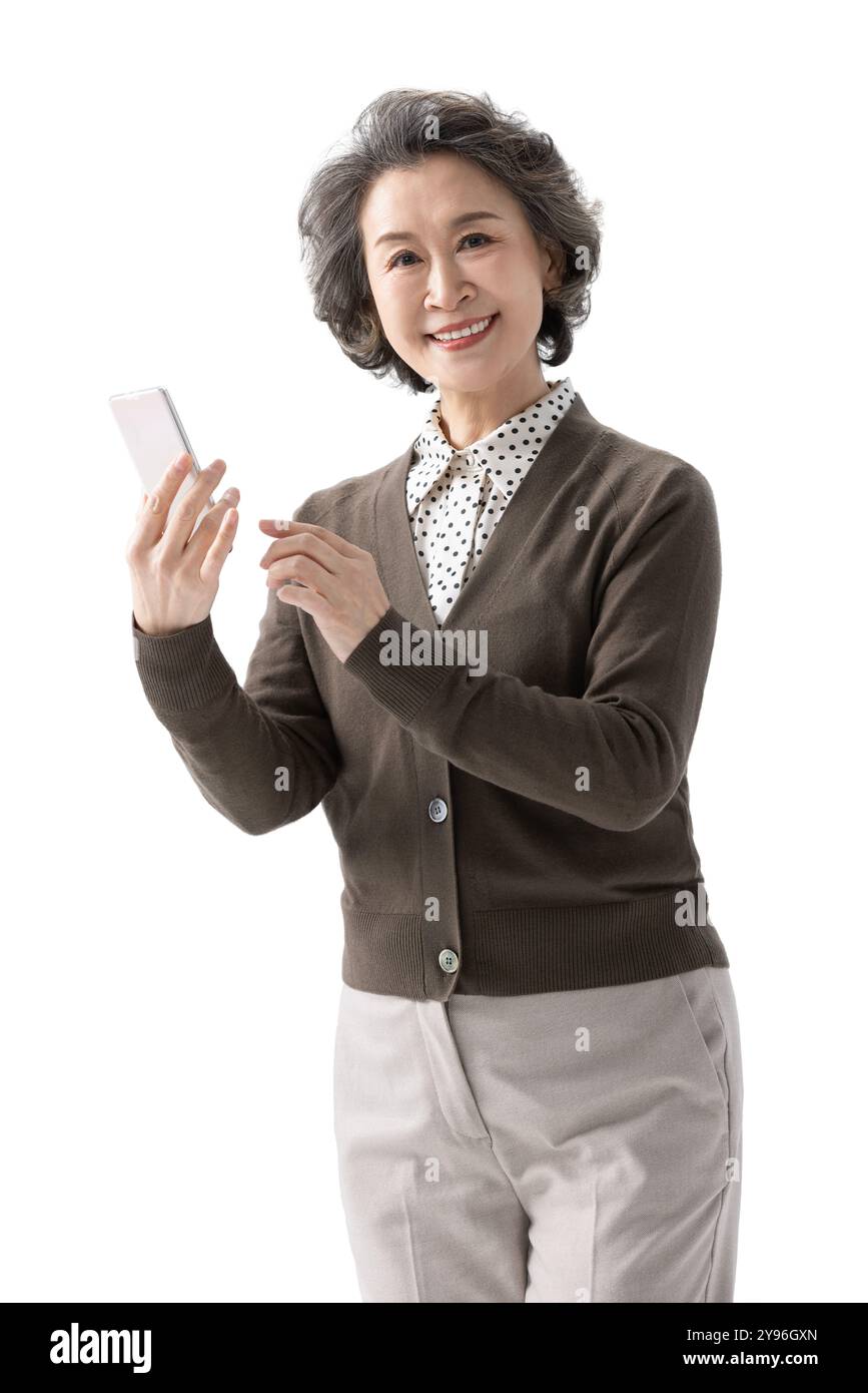 Happy senior woman using smart phone Stock Photo