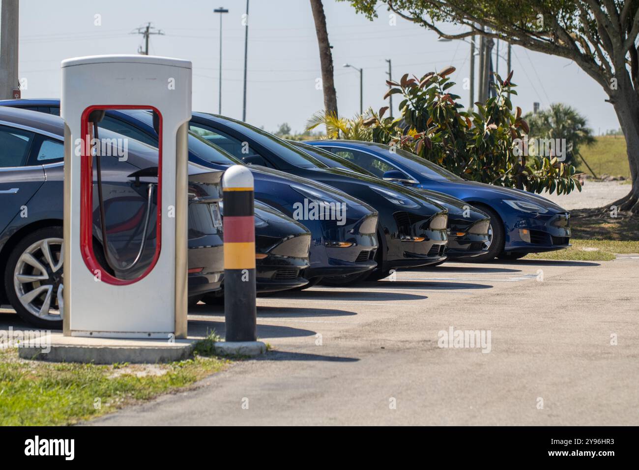 Electric Cars Charging at a rest stop Stock Photo - Alamy
