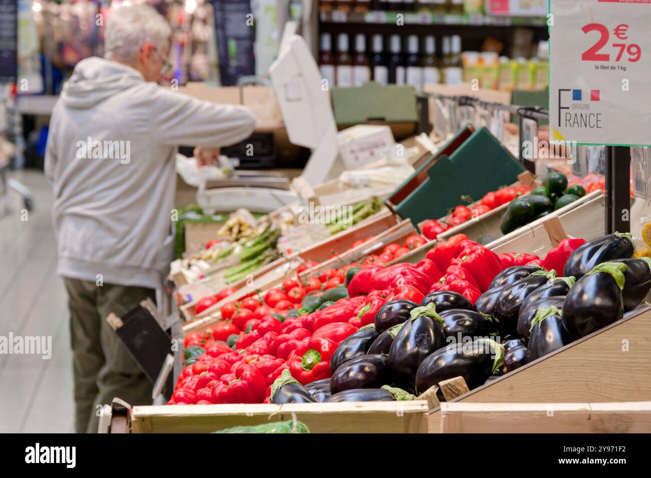 Antibes (south-eastern France): this Carrefour hypermarket is one of the brand's top three hypermarkets. Elderly customer at the fruit and vegetable c Stock Photo