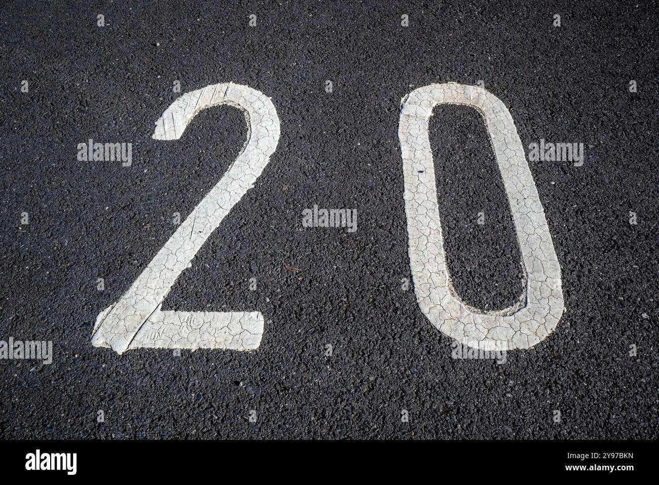 Number twenty 20 painted in white on tarmac Stock Photo