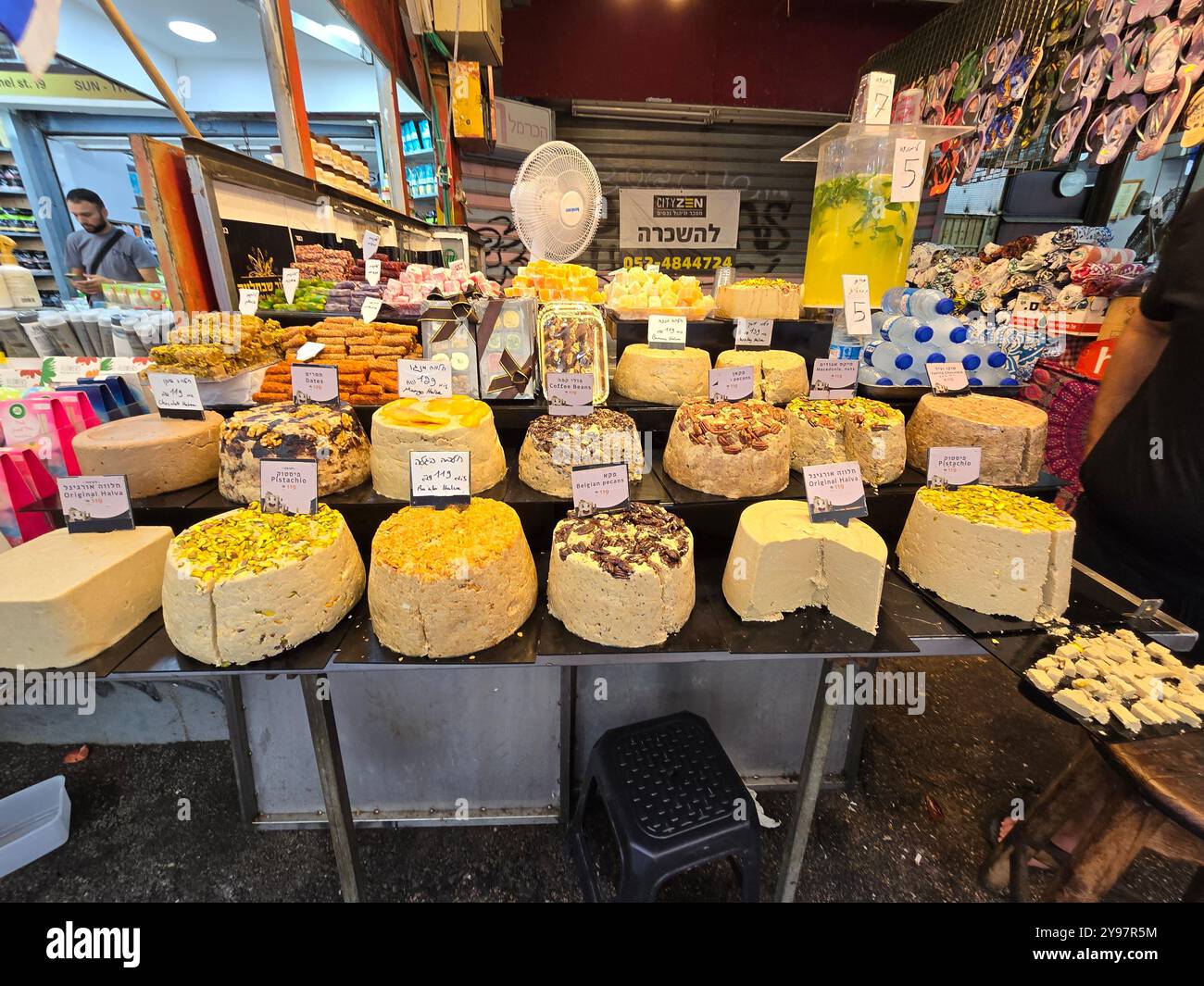 A confectionery vendor selling Halva, Turkish Delight and other sweets at the Carmel market in Tel-Aviv, Israel. - Smartphone Captured Stock Image