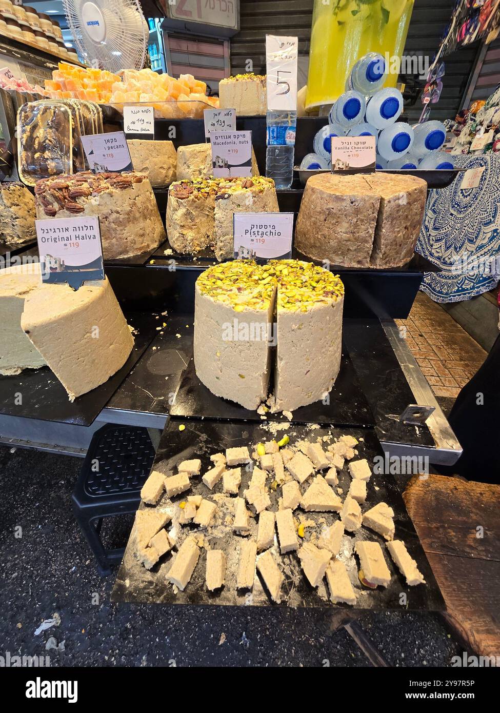 A confectionery vendor selling Halva, Turkish Delight and other sweets at the Carmel market in Tel-Aviv, Israel. - Smartphone Captured Stock Image